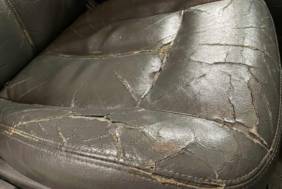 Best Plasticizer for Artificial Leather and Synthetic Leather 2 Cracked and sticky synthetic leather car seat showing plasticizer migration damage